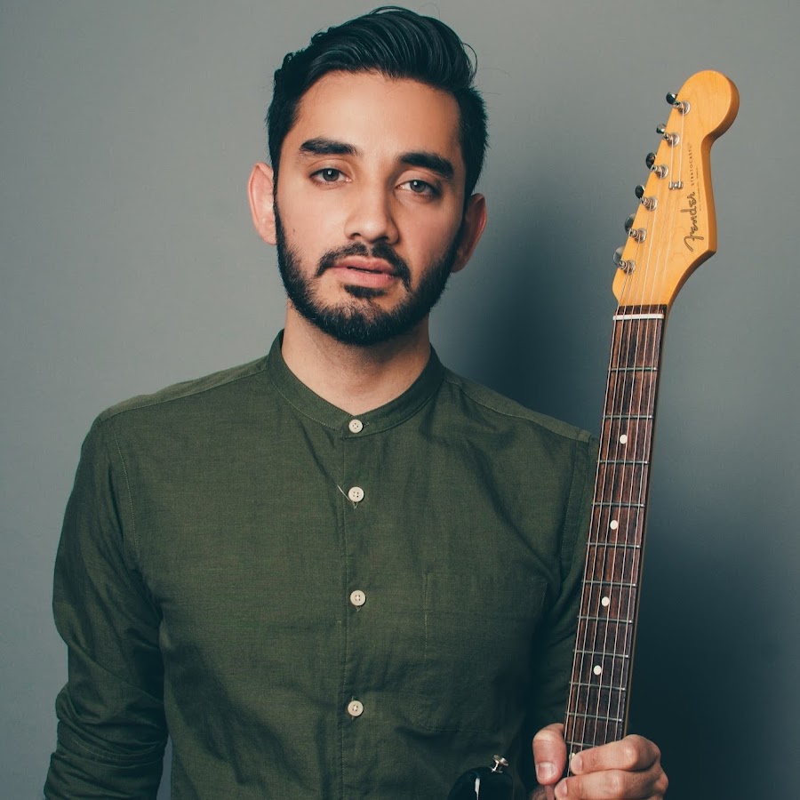 Guitarist & Composer Shubh Saran holding a Fender guitar