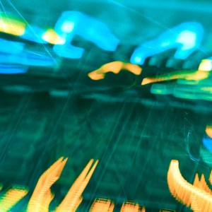 Abstract photograph of a mixing desk, with distorted blue and orange LED lights. Image is the cover for The Musical Endeavour's 8-Hour LoFi E.P.